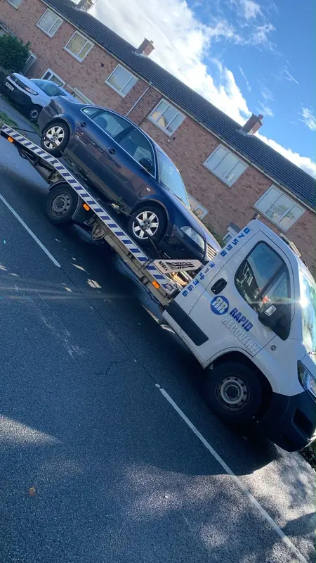 Rapid Recovery truck carrying a vehicle in Northamptonshire
