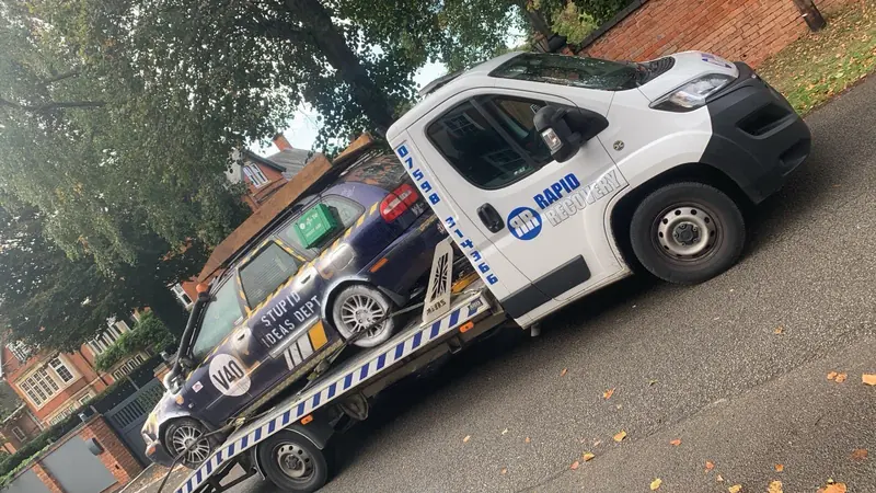 Rapid Recovery truck carrying a vehicle in Northamptonshire