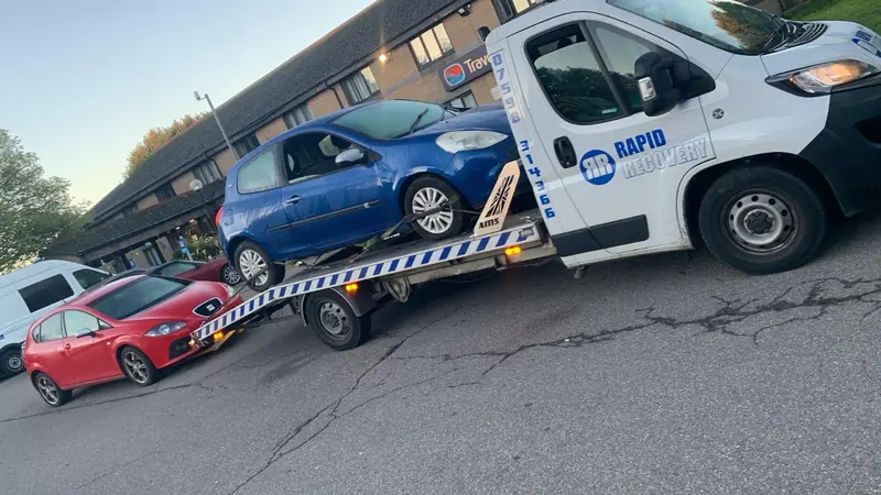 Rapid Recovery truck carrying a vehicle near Rushton