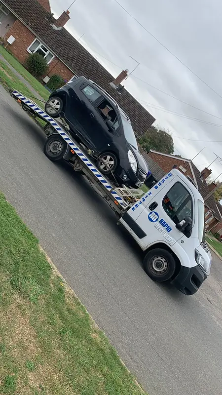 Rapid Recovery truck carrying a vehicle in Northamptonshire